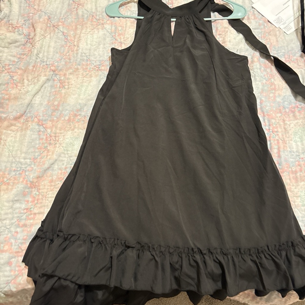 Black halter dress ruffle hem.